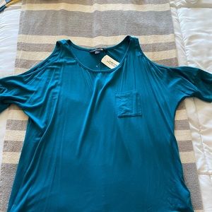 Teal shirt with open shoulder
